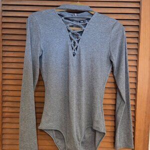 body suit with criss cross front detail